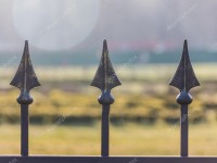 depositphotos_69629803-stock-photo-fragment-forged-metal-fence-outdoor